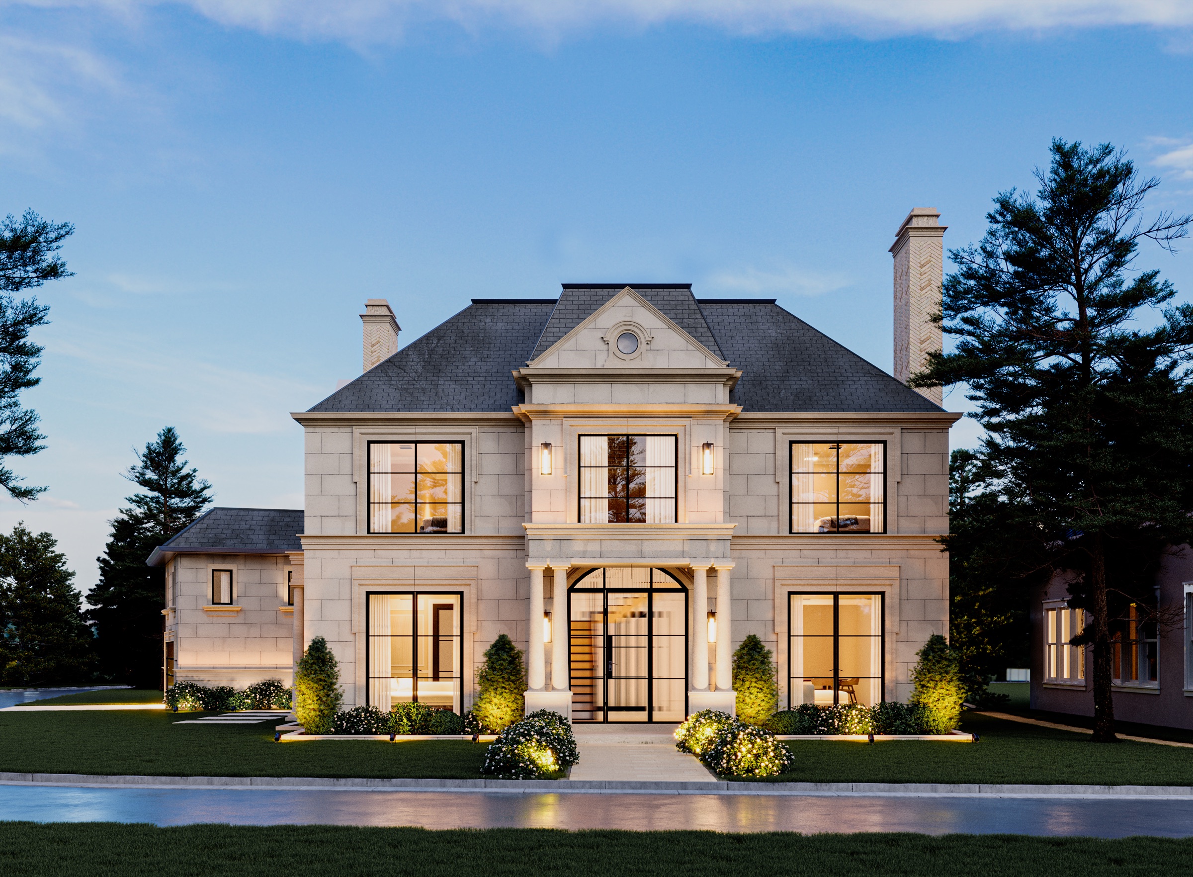 A limestone custom home at dusk