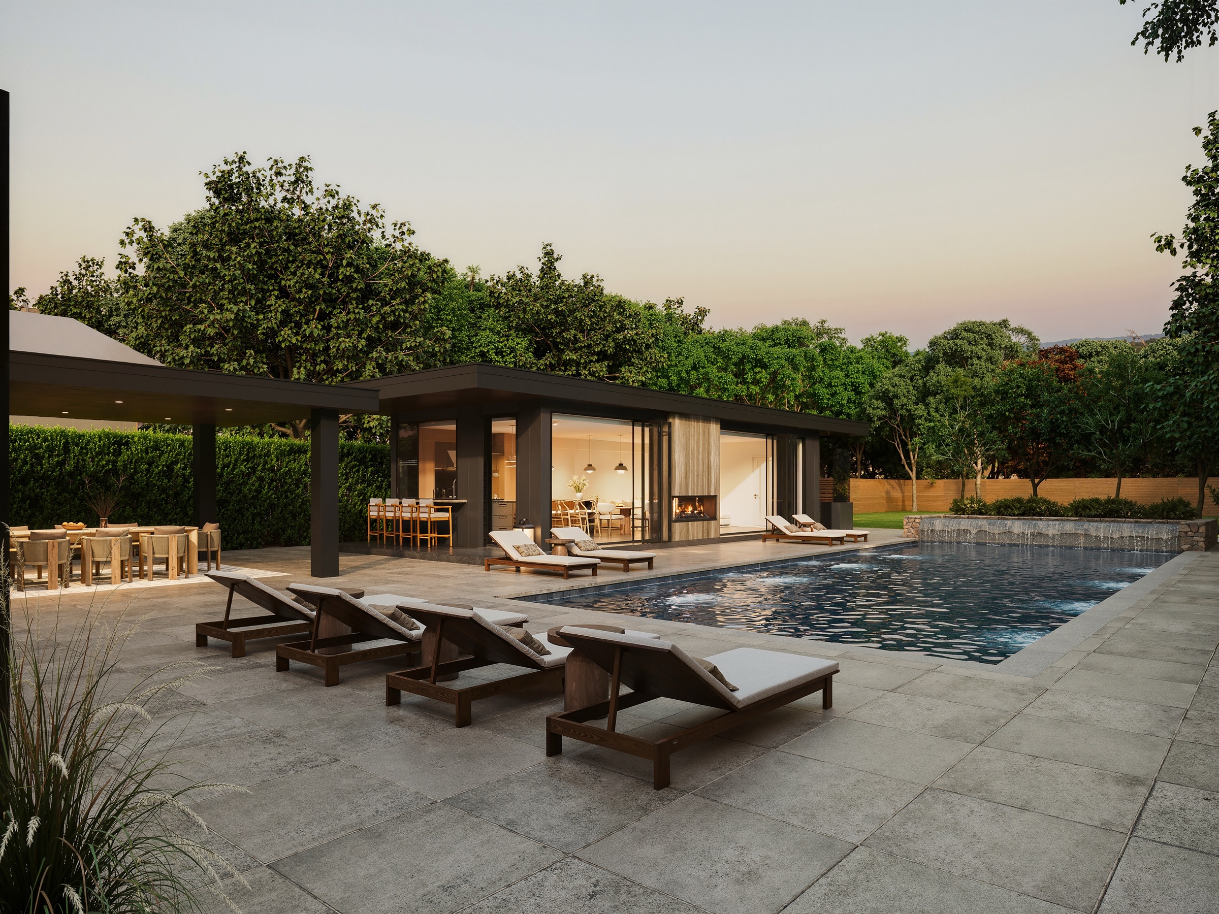 A pool, cabana and terrace at twilight