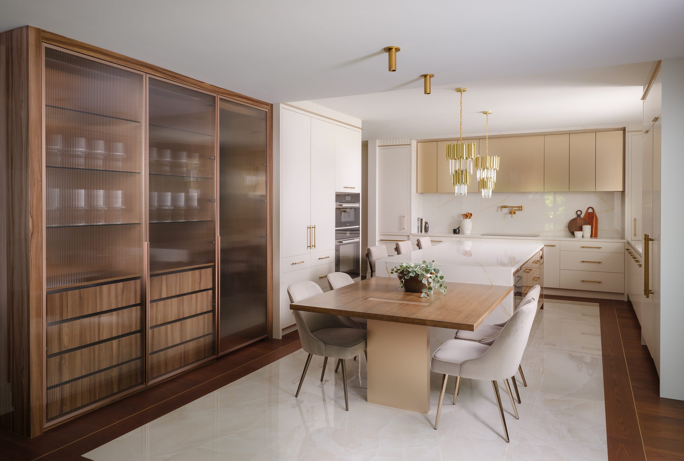 A kitchen with fluted glass and walnut joinery